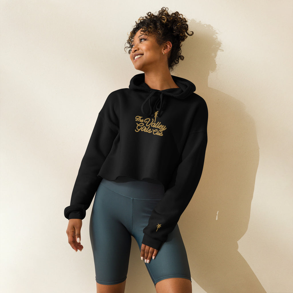 Woman wearing Valley Girls Club black cropped hoodie California lifestyle apparel